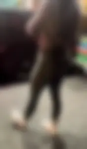Tiny Asian leaving the gym in green leggings