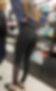 Teen pulling up her leggings at the store