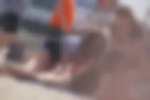 A group of teens in bikinis on the beach
