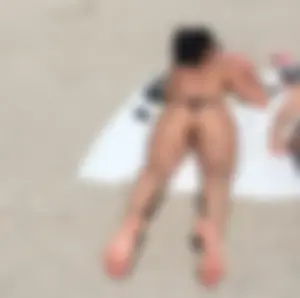 Group of hot candid girls laying on the beach creepshots