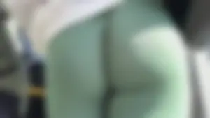 Ebony with a DEEP WEDGIE  in Green Leggings