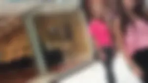 Little blonde teen in grey leggings at the mall with her friends