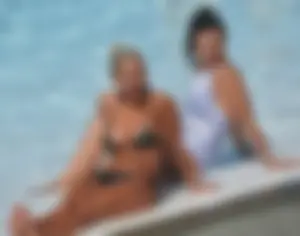 Classy blonde bikini milf lounging at the pool with her sister [088]
