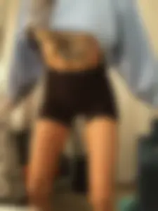 Girl with Tattooed Stomach and Thin Muscular Legs in Spandex Shorts Creepshot
