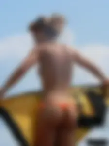Two topless friends on the beach with nice boobs