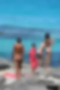 Older lady on a nude beach showing her body