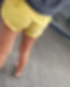 Skinny ass eating her yellow shorts