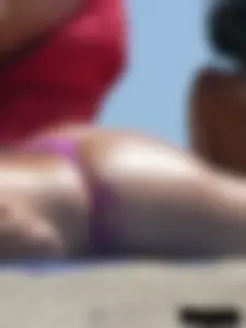 Purple thong topless lady on the beach gets oiled up by her husband