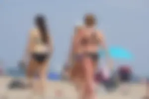 3 sexy girls with nice asses walking on the beach in bikinis