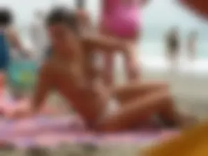 Hot topless girl on the beach in a thong bikini with a nice ass