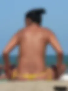 Bunch of sexy babes on the beach topless and in thong bikinis