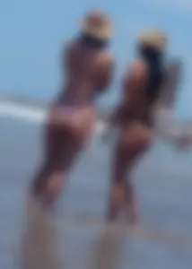 2 milfs in thong bikinis on the beach