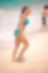 Assortment of sexy babes at the beach in bikinis