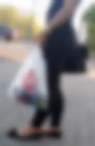 Nice Milf’s Booty in Tight Pants on the Street Closeup Photo