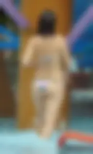 Milf in a bikini with a big booty at the pool