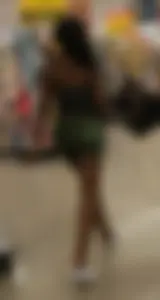 Ebony chick grocery shopping in green shorts