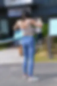 Hula hooping skinny Asian in light blue leggings with vpl