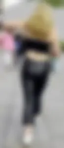 Sexy blonde in tight shiny jeans and croptop