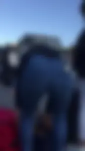 Teen in jeans pants bend over