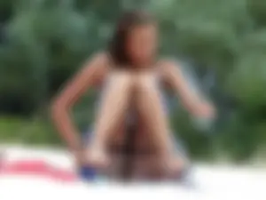 Girl accidentally flashing her pussy while changing at the beach