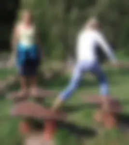 Girl in Jeans Shoeless in the Park