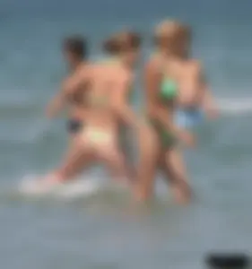 A bunch of sexy beach voyeur babes in bikinis, thongs and topless
