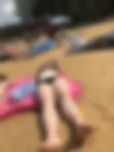 Hot Girls in Swimsuits Lying on a Beach Gallery