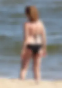 Two sexy beach teens in bikinis, one thick and one skinny with big boobs