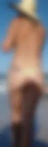 Cute girl on the beach with a decent body in thong bikini