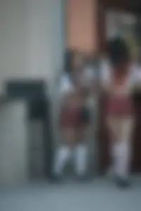 Two sexy Tilted Kilt employees showing cleavage and cheeks