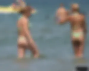 A bunch of sexy beach voyeur babes in bikinis, thongs and topless