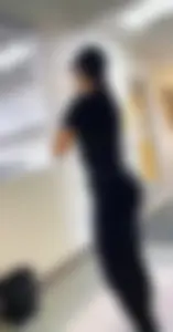 Hot Girl in Leggings Standing in the Hallway Creepshot