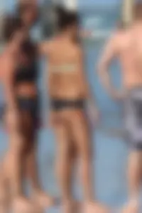 Beach girl out in a bikini with a nice round big booty