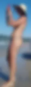 Cute girl on the beach with a decent body in thong bikini