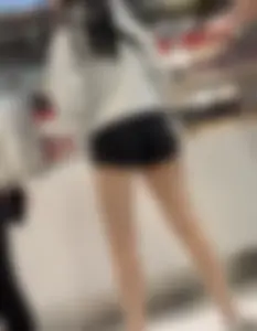 Asian girl in tight black shorts at the mall