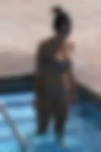 Sexy pool teen with big boobs barely staying in her top