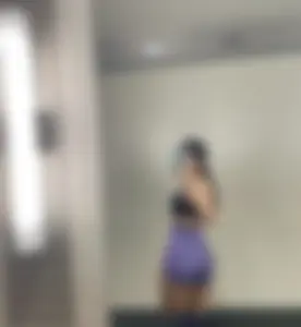 Hot Girl in Spandex Shorts And a Top Taking Mirror Selfies in the Gym Toilet