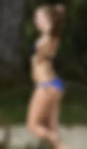 Cute girl playing volleyball in her little bikini