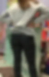 Ass standing around in tight grey patterned leggings