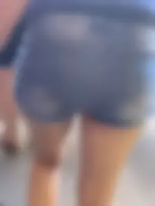 Bunch of girls in various outfits at a Cardinals baseball game