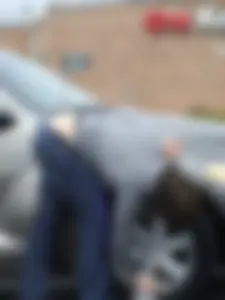 Girl cleaning her car in jeans and showing some cheetah print underwear