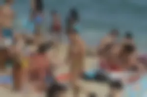 Topless girls on a beach in Barcelona
