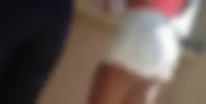 Sexy black girl in short white shorts
