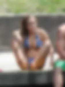 Sexy girl at the pool in a bikini with great tits