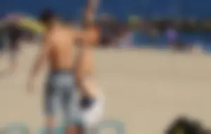 Beach teen in semi thong bikini under see through dress on the beach