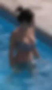 Sexy pool teen with big boobs barely staying in her top