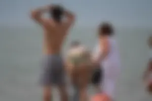 Petite chick with a big booty at the beach in a high waist bikini