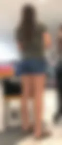 Brunette babe in denim shorts with a sexy ass and legs