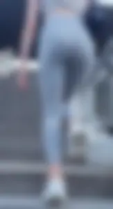 Skinny girl in super thin grey pants upstairs