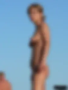 Bunch of sexy babes on the beach topless and in thong bikinis